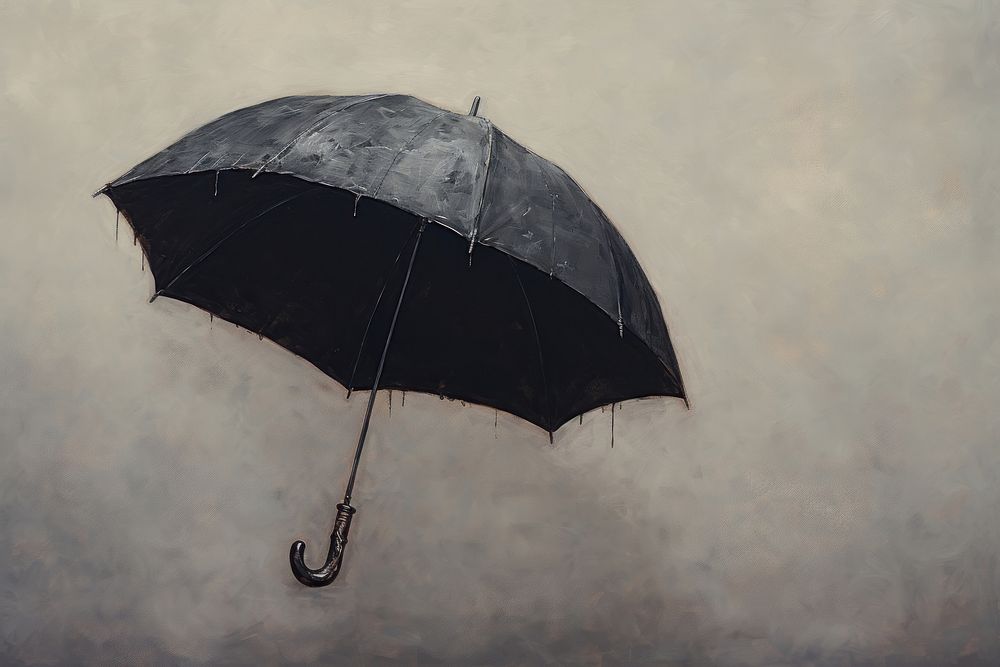 A close up on pale a black umbrella canopy.