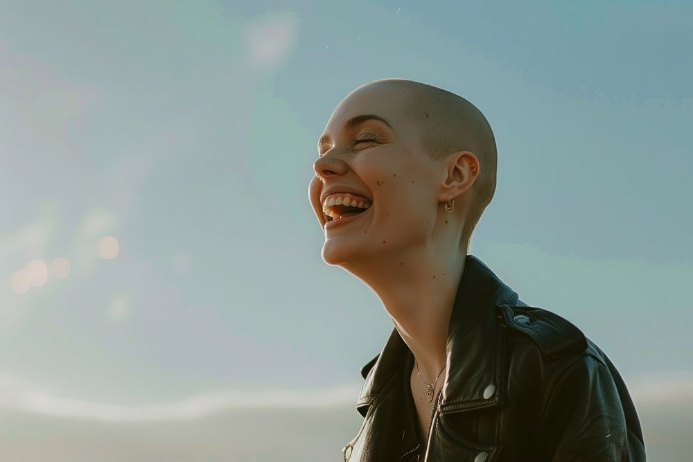 Bald woman laughing accessories accessory necklace.