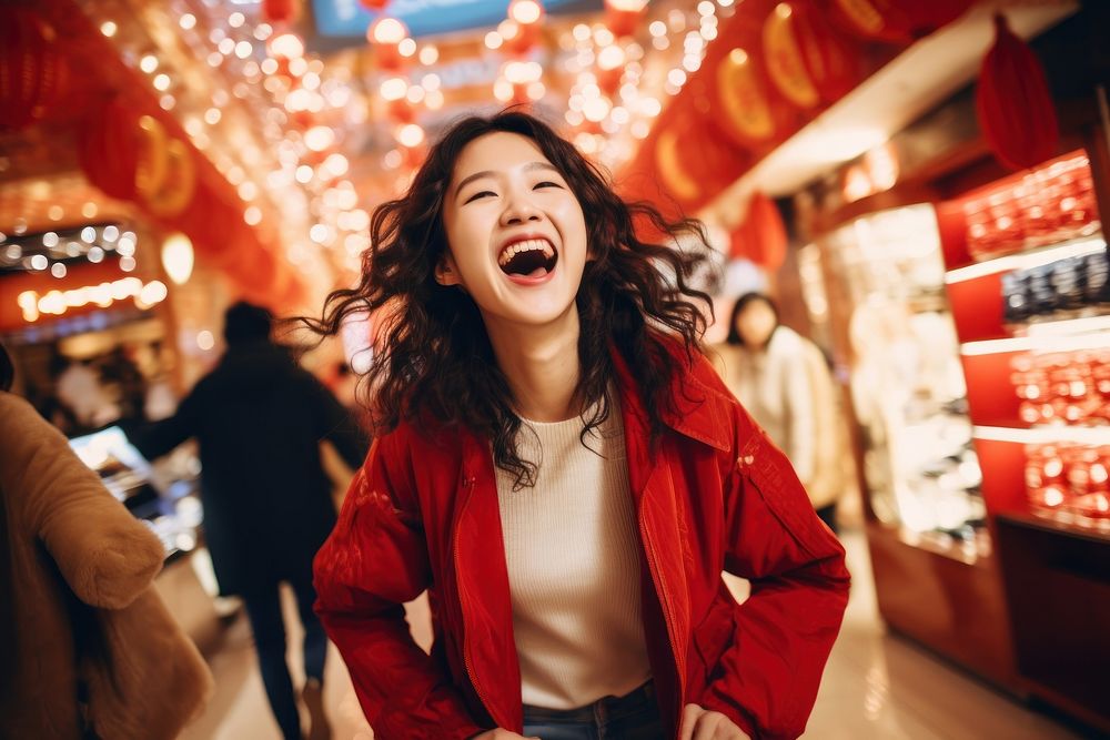 Happy chinese in shopping mall laughing person female.