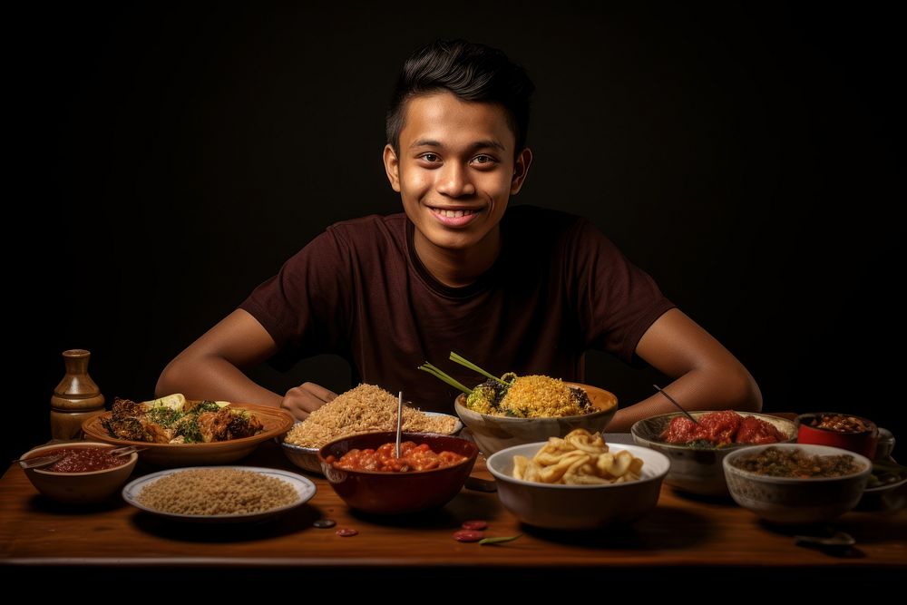 Indonesian person eating food furniture.