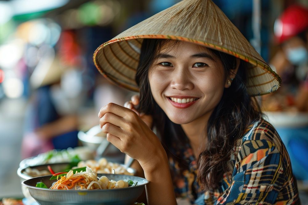 Vietnamese person eating food clothing.