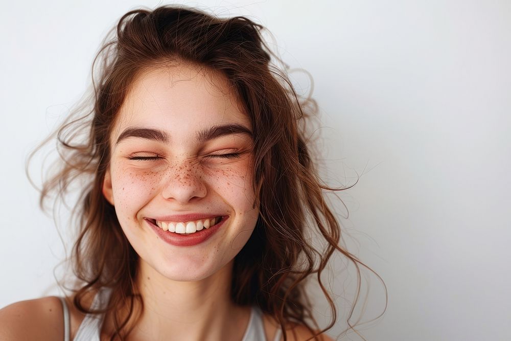 Girl winks laughing adult smile.
