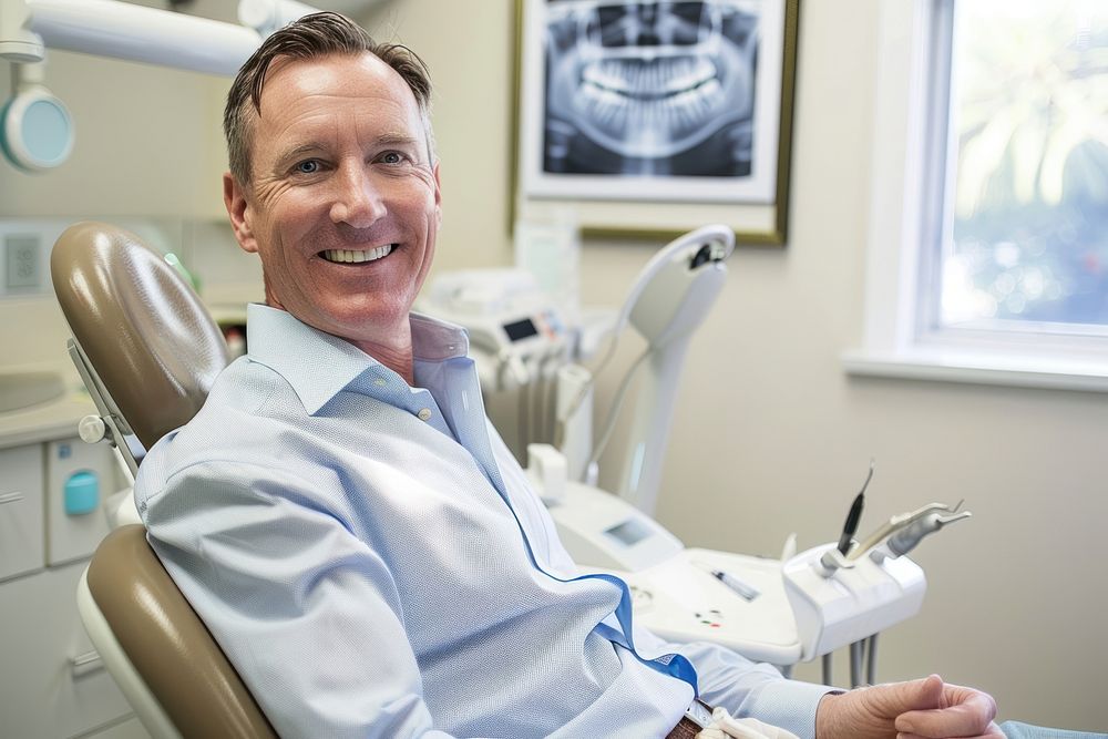 Man smiling with white teeth hospital dentist adult.