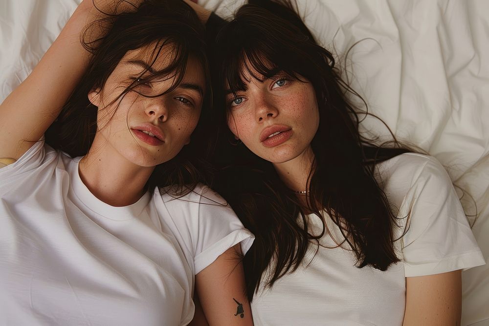 Two women posing for a t-shirt merch drop photoshoot portrait adult togetherness.