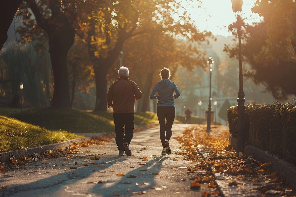Older man and woman jogging walking running.