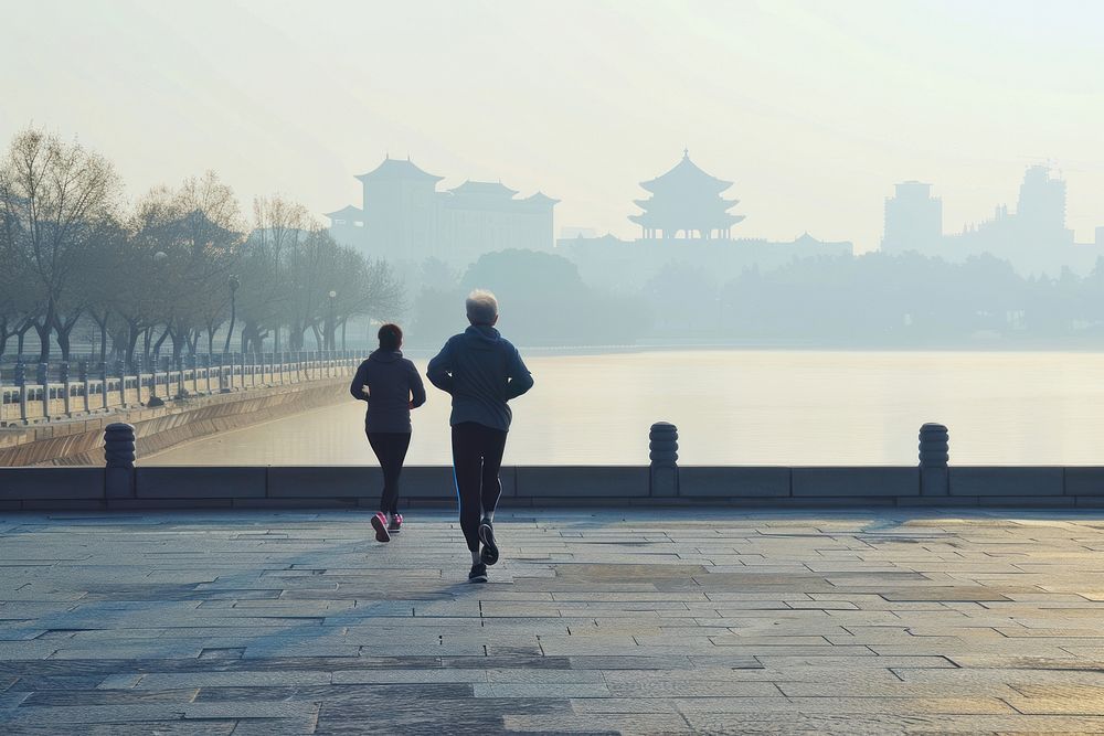 Older man and woman jogging morning running.