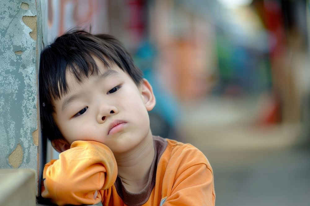 Asian boy looks tired portrait worried child.
