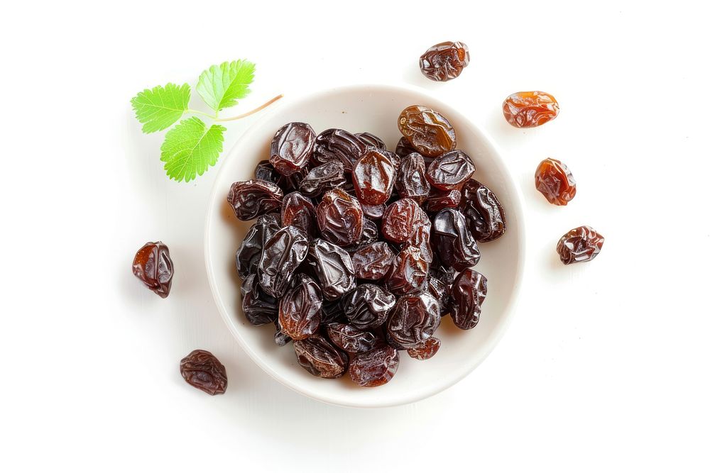 Photo of raisin raisins plate white background.