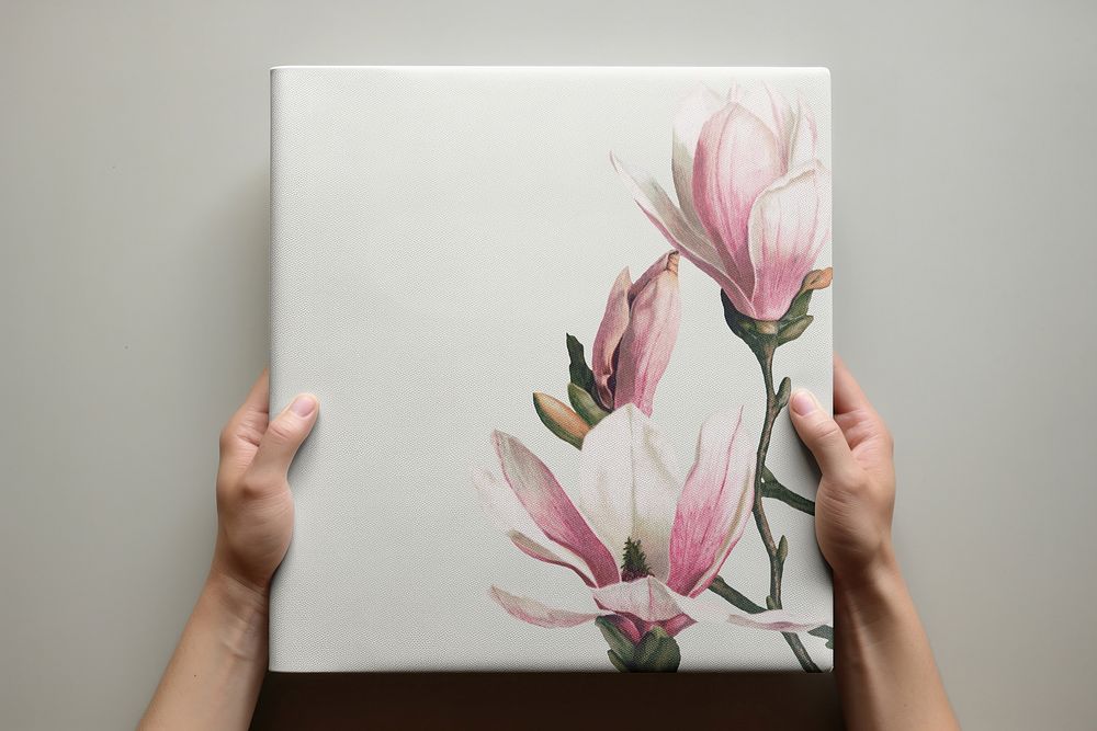 hand holding floral hardcover book