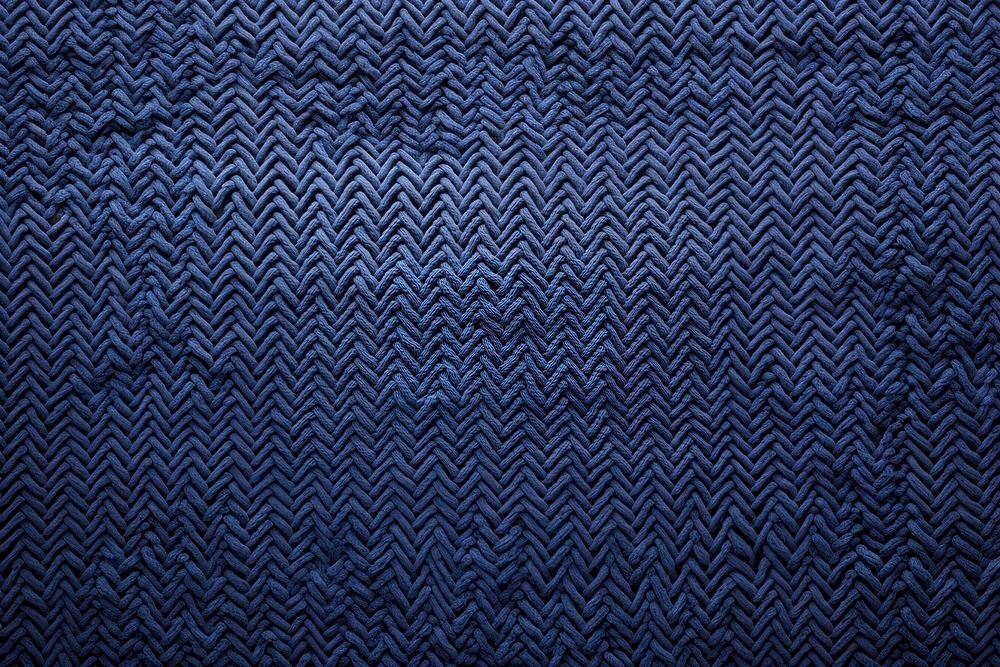Seamless pattern of an embroidered knitted texture blackboard blue.