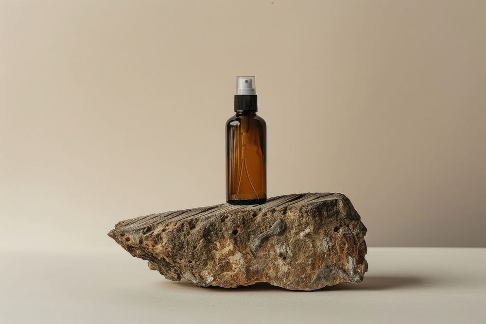 Spray bottle rock wood cosmetics.