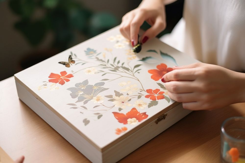 Hand painting on wooden box craftsperson calligraphy paintbrush.