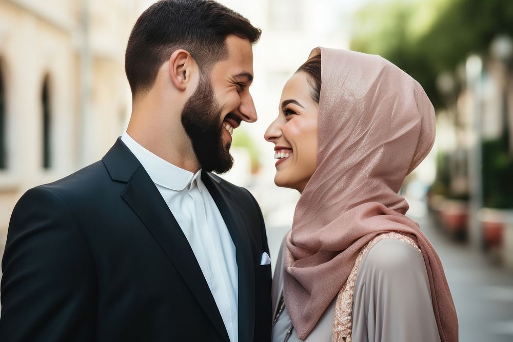 Arabic couple newlywed looking at each other happy laughing person.