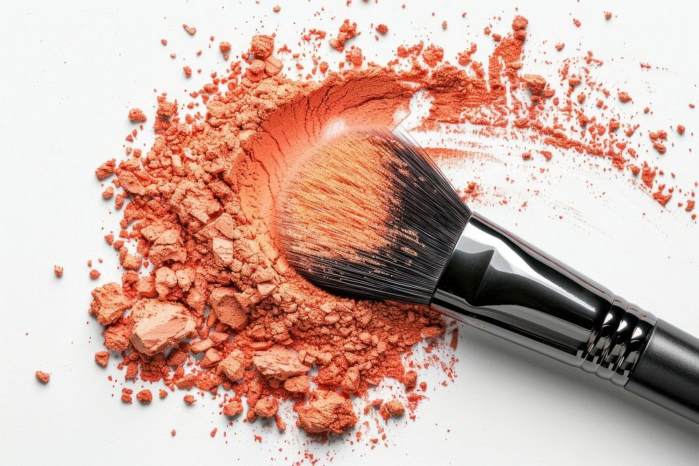 Orange color cosmetics brush powder.