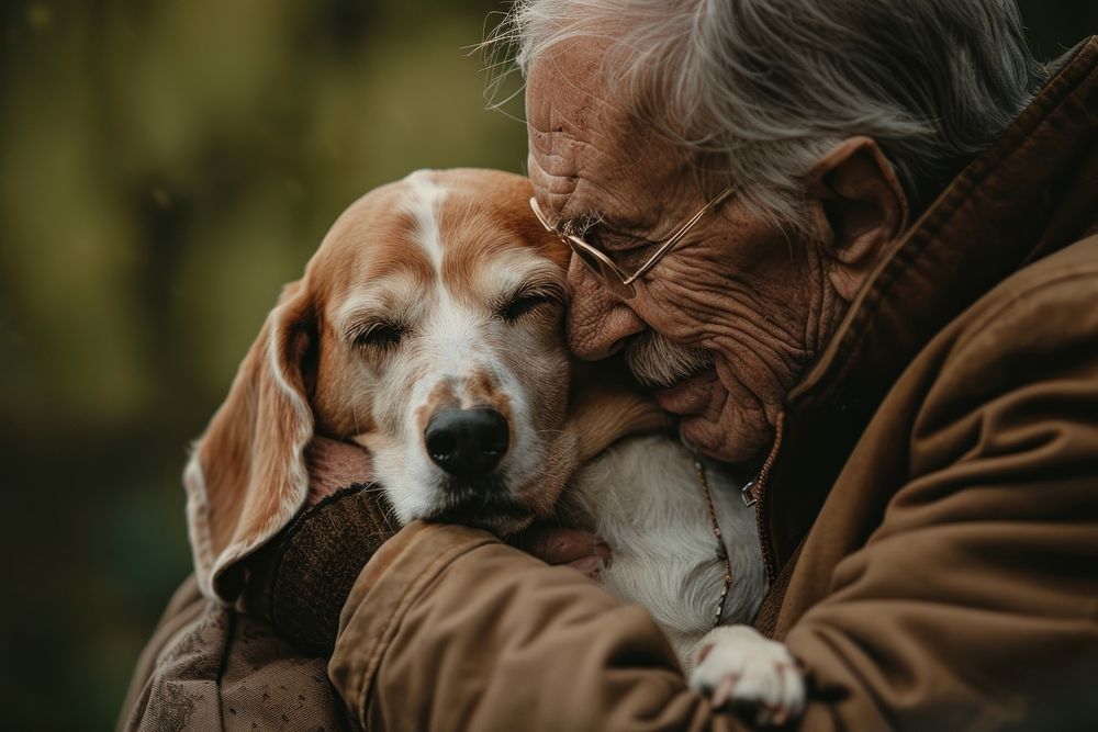 A elderly guy cuddling a dog accessories accessory glasses.