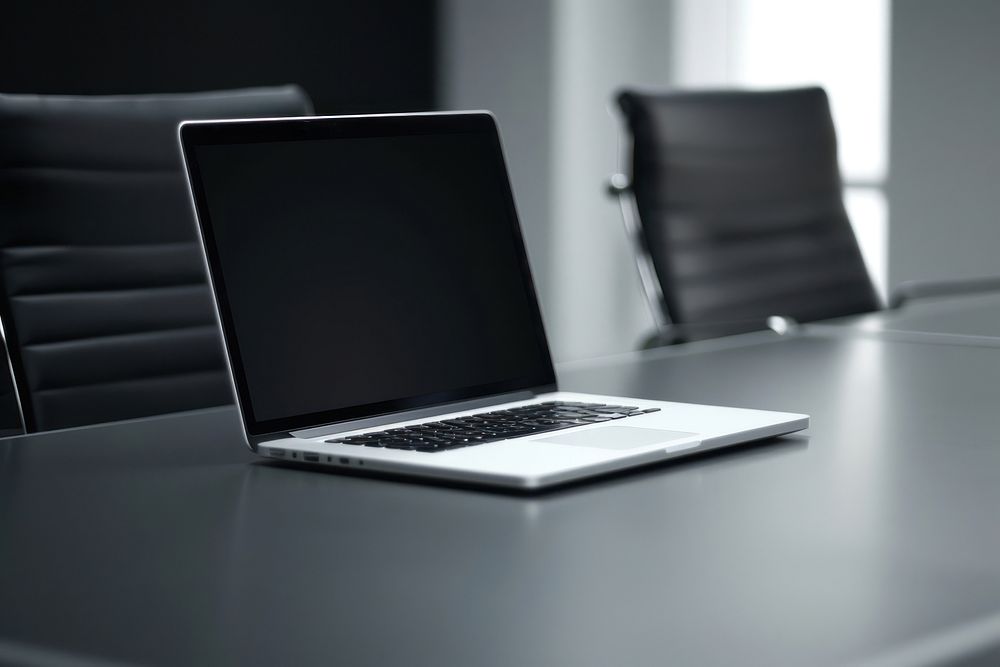 Blank white laptop mockup on a table electronics furniture computer.