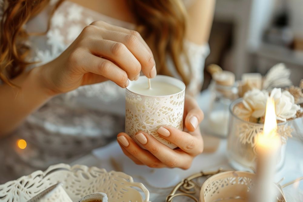 Woman making diy candle food cup mug.