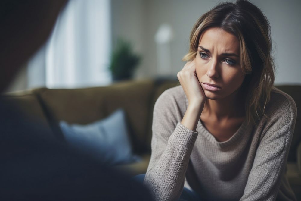 Photo of an anxiety woman clothing knitwear worried.