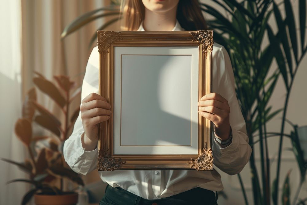 Holds an vintage photo frame mockup painting person human.