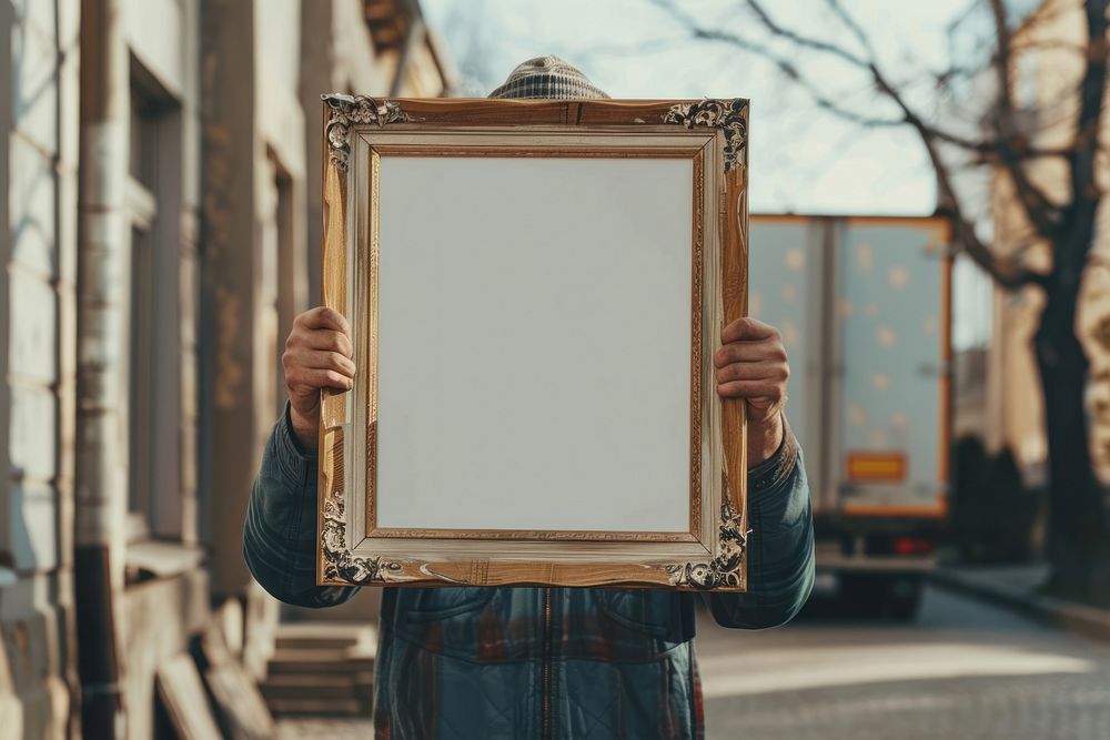 Holds an vintage picture frame mockup painting person human.