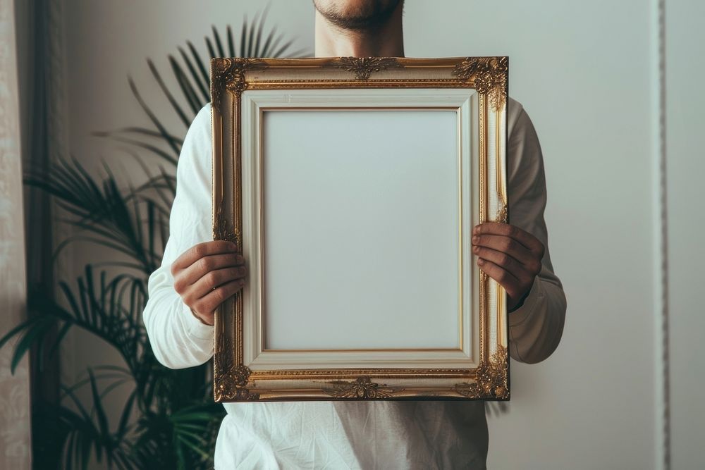 Holds an vintage photo frame mockup art painting.