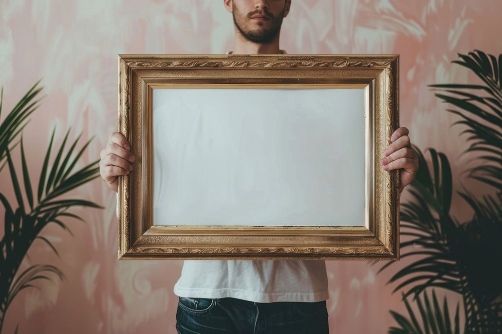 Holds an vintage photo frame mockup art painting person.