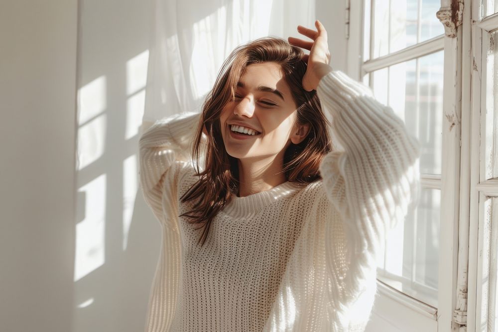 Woman waving smiling sweater laughing clothing.