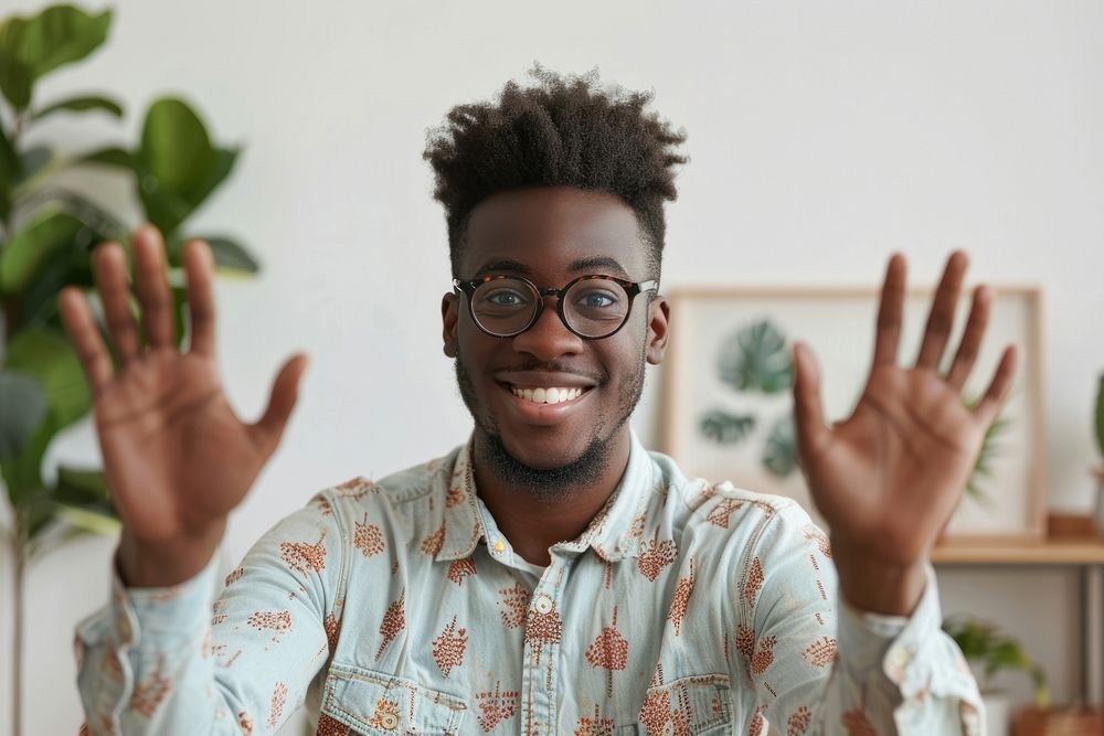 Young black man waving hand smile accessories surprised.