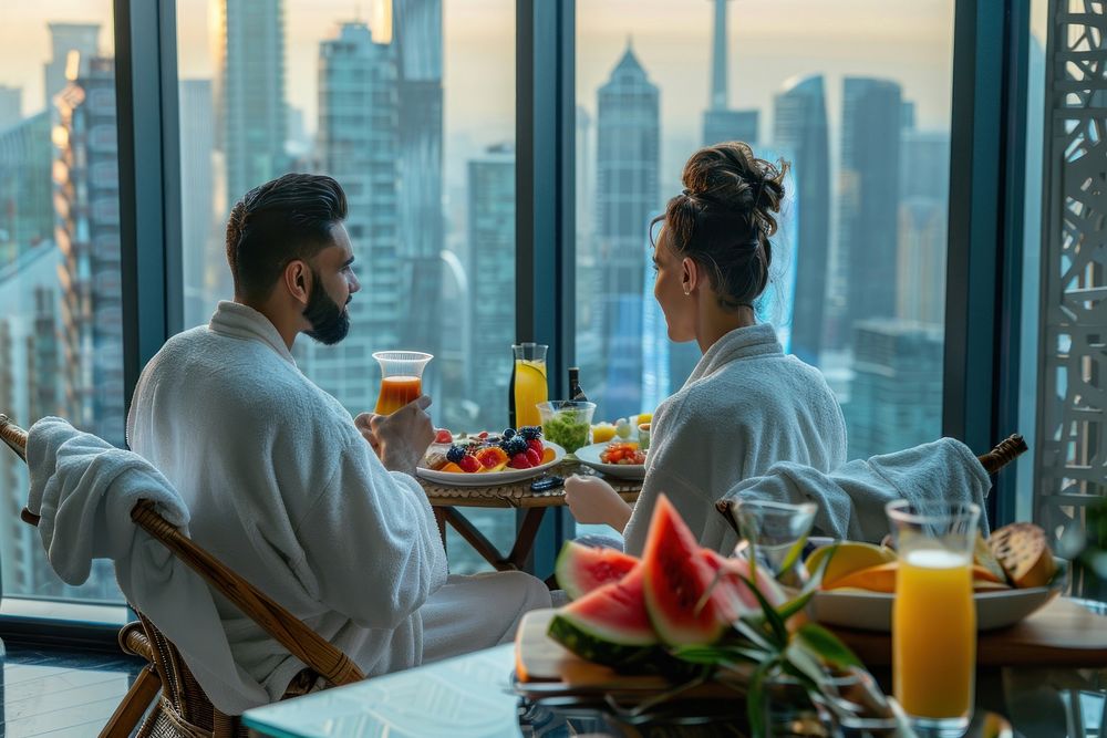 Couple in bathrobes woman drink food.