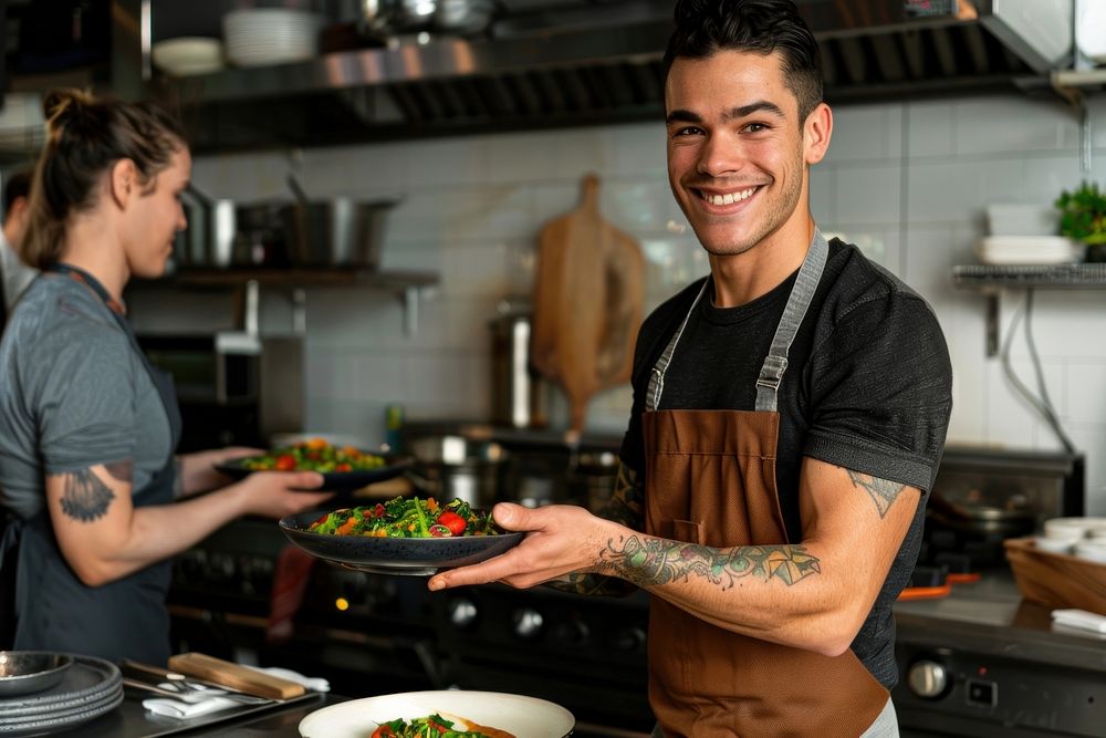 An attractive young chef tattoo plate person.