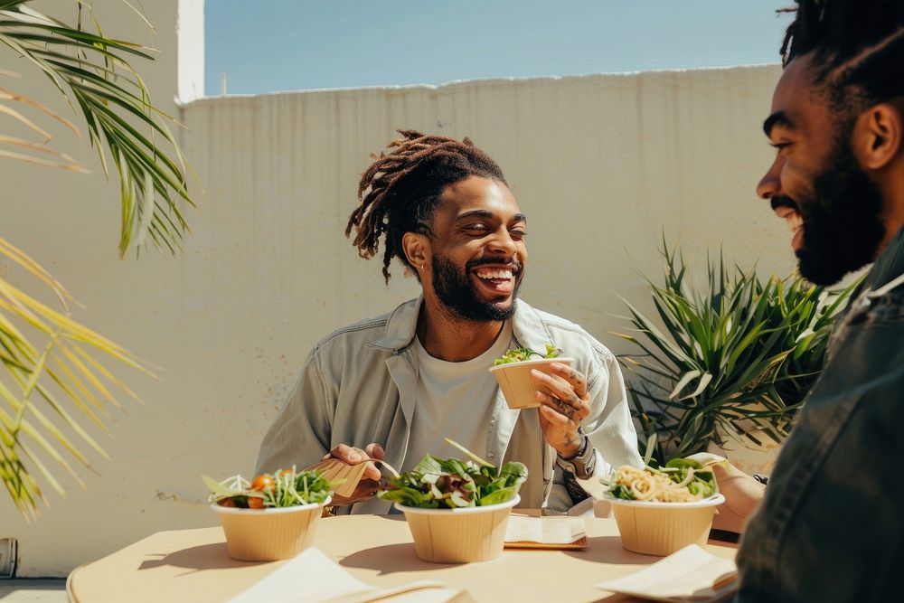 A photo of happy man eating romantic laughing dating.