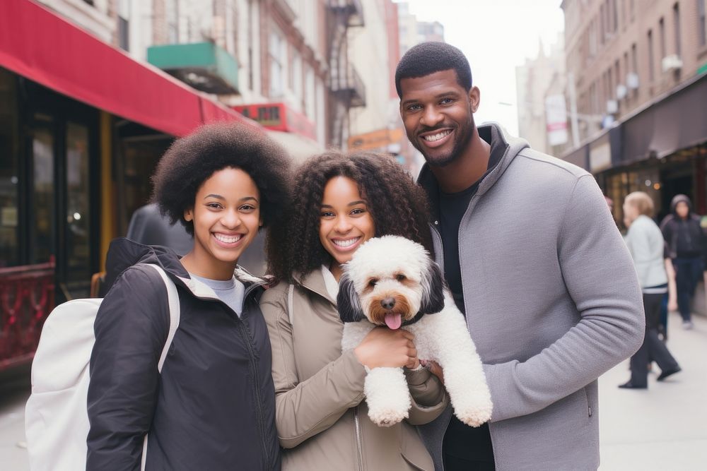 Black family and someone holding puppy portrait mammal street.