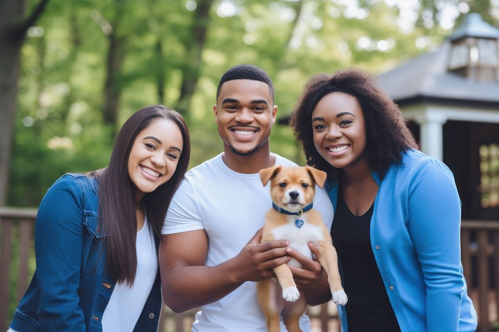 Black family and someone holding puppy portrait mammal adult.