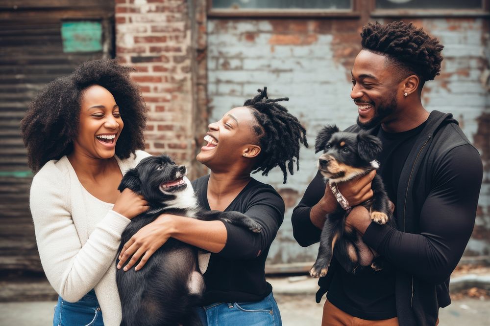 Black family and someone holding puppy laughing portrait mammal.