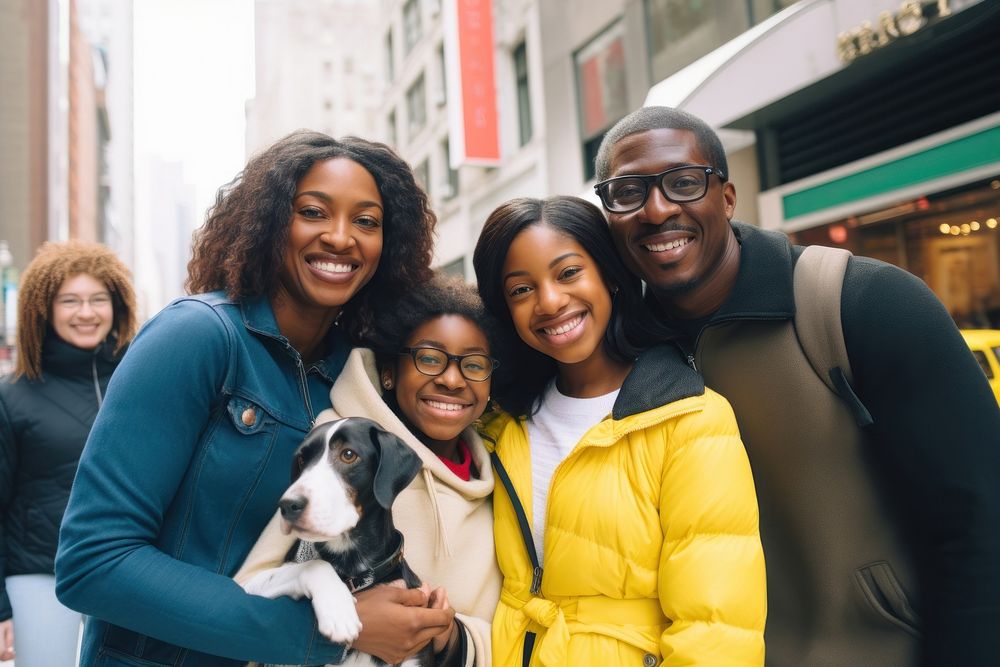 Black family and someone holding puppy portrait mammal adult.