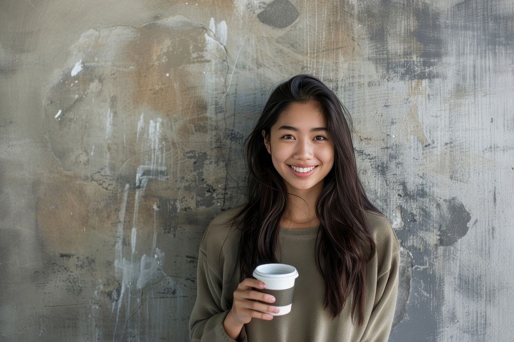 Happy south east asian woman happy photo cup.