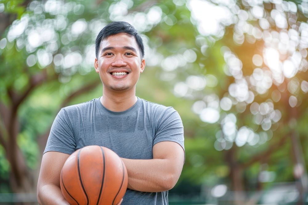 Happy south east asian man basketball happy dimples.