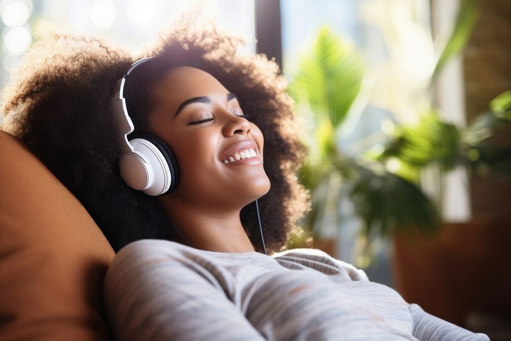 Afro American teen woman headphones happy electronics.