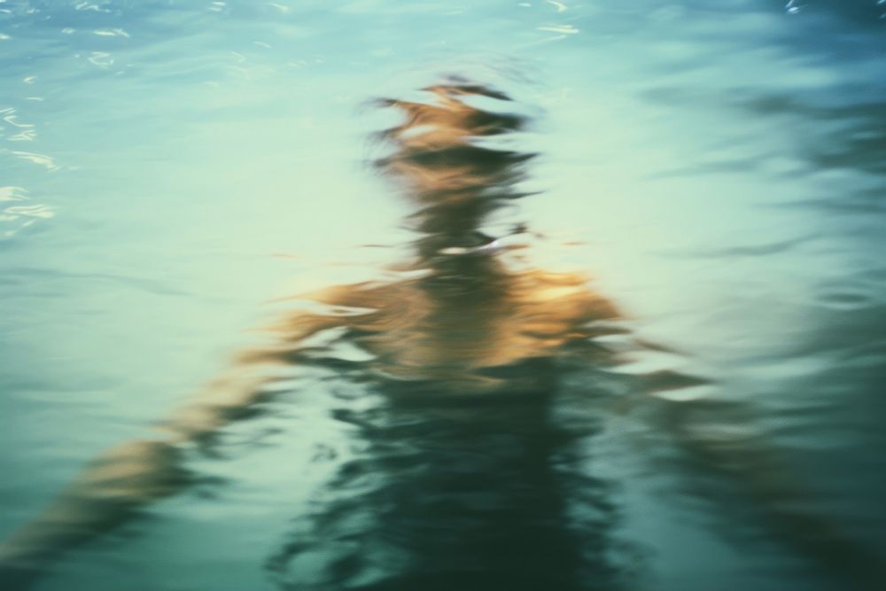 Person swimming recreation underwater outdoors.