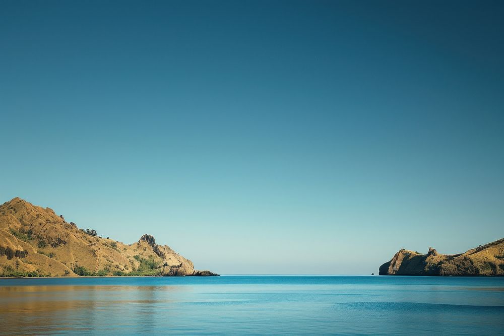 Clear blue sky and sea at Padar island promontory landscape shoreline.