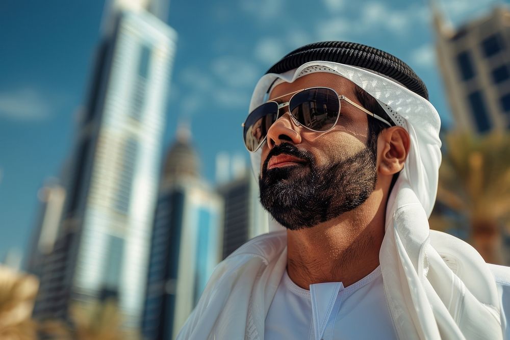Arab Middle Eastern man wearing emirati kandora traditional clothing in the city accessories accessory dimples.