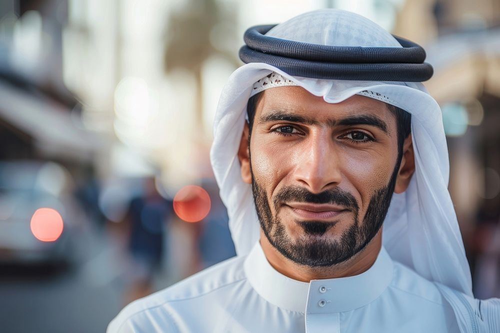 Arab Middle Eastern man wearing emirati kandora traditional clothing in the city dimples people person.