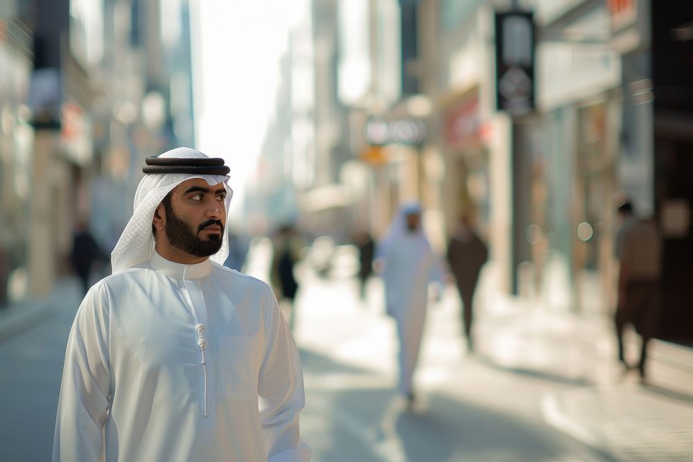 Arab Middle Eastern man wearing emirati kandora traditional clothing in the city pedestrian people person.