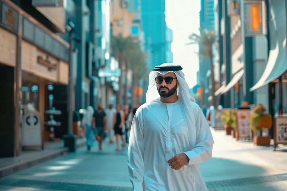 Arab Middle Eastern man wearing emirati kandora traditional clothing in the city accessories pedestrian sweatshirt.