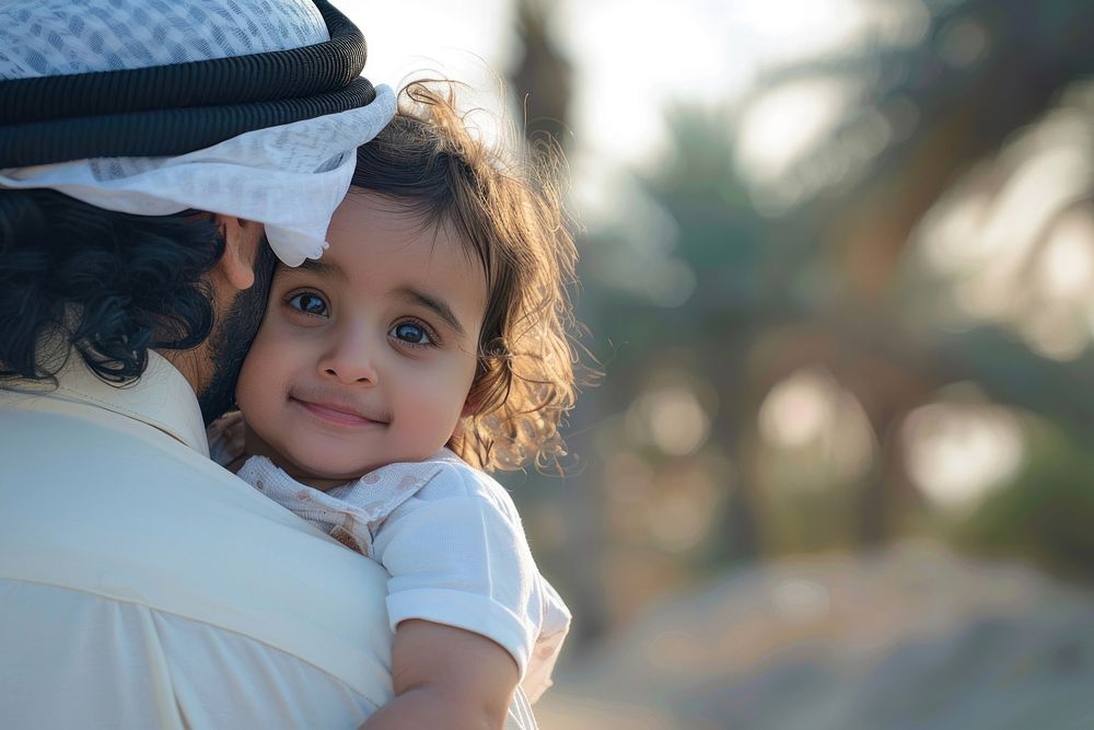 Happy middle eastern child enjoying ride on father back outdoor photo happy photography.