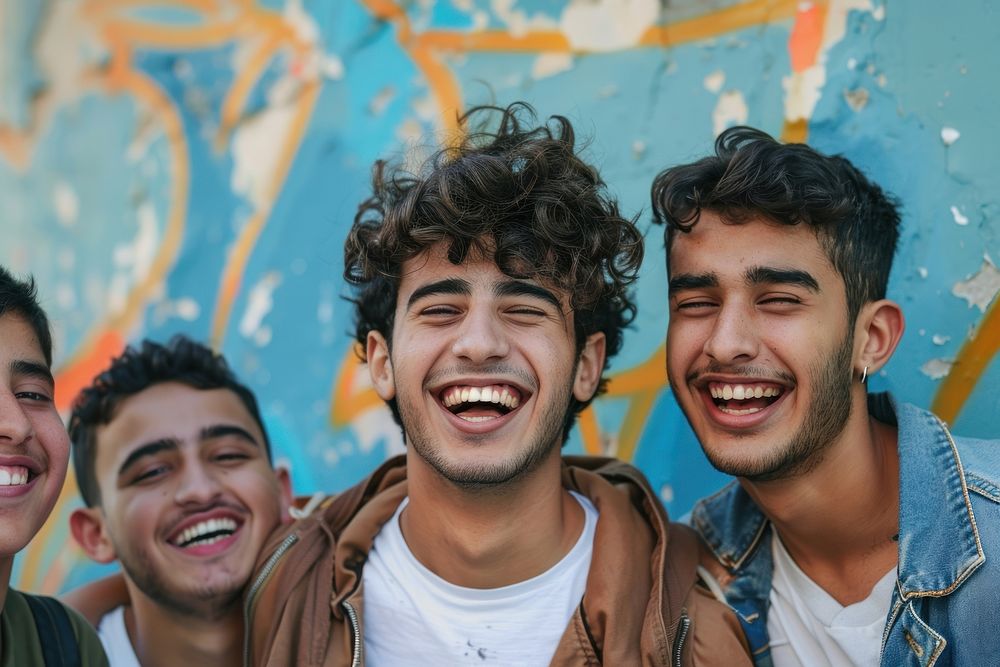 Happy middle eastern laughing with teenage male friends happy person human.