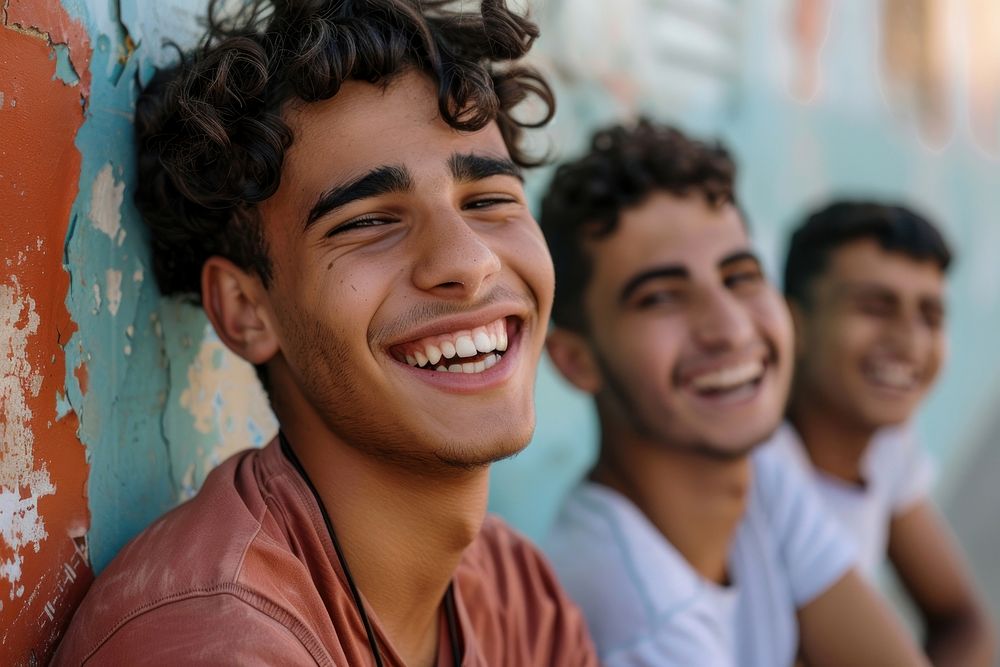 Happy middle eastern laughing with teenage male friends happy person human.