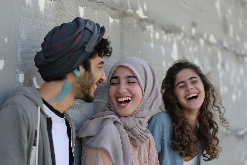 Happy middle eastern laughing with teenage female and male friends happy person people.