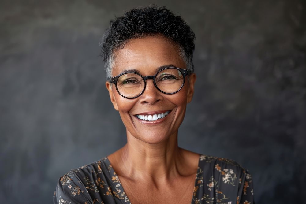 Portrait of happy mature businesswoman wearing spectacles portrait photo photography.
