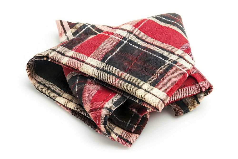 Folded napkins with tartan pattern blanket plaid.